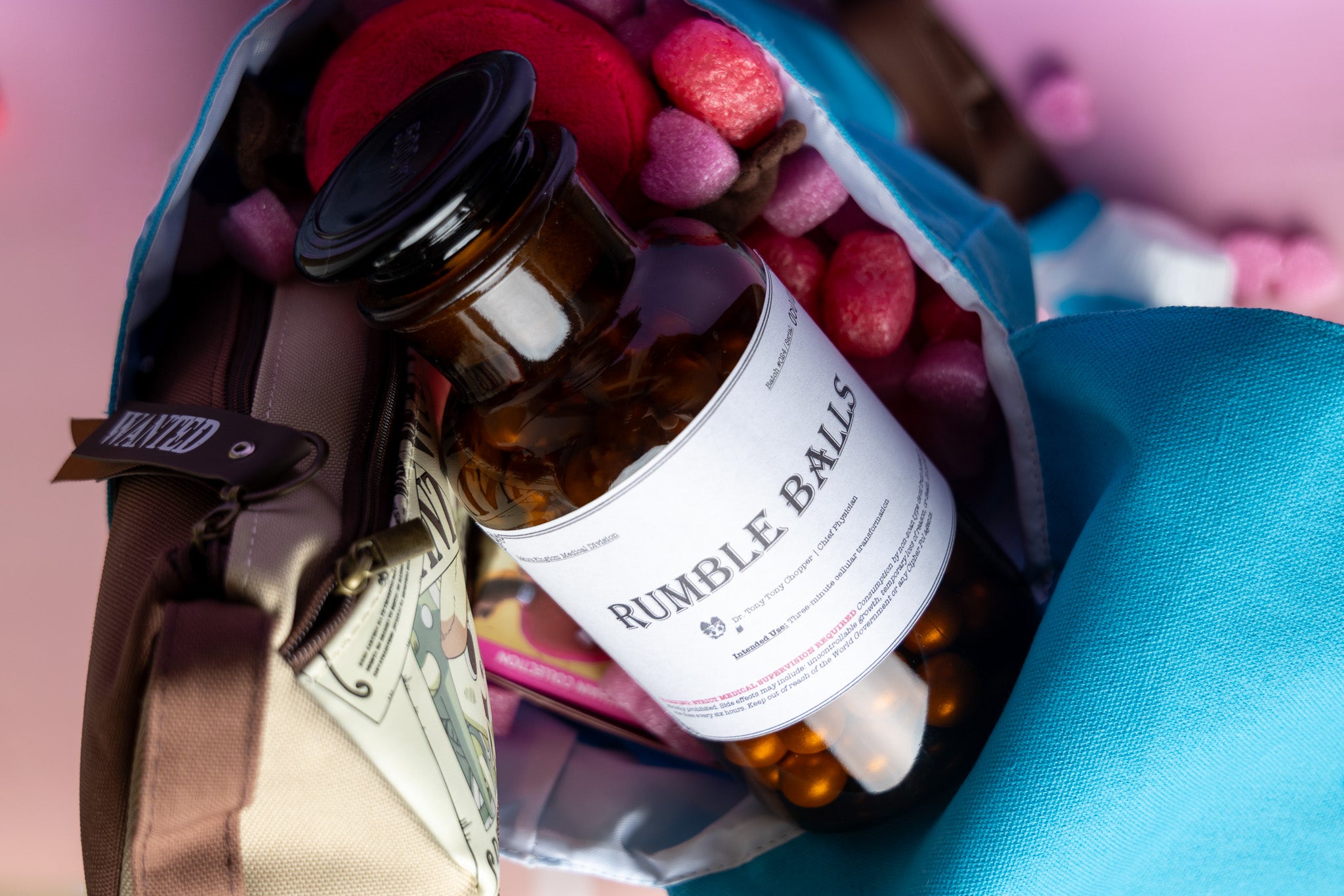 A bottle of Rumble Balls on top of a blue bag